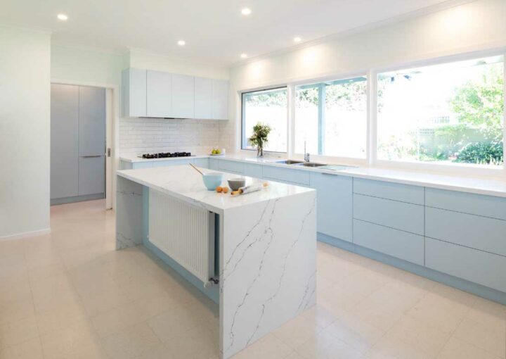 A beautiful newly renovated kitchen with a marble island bench